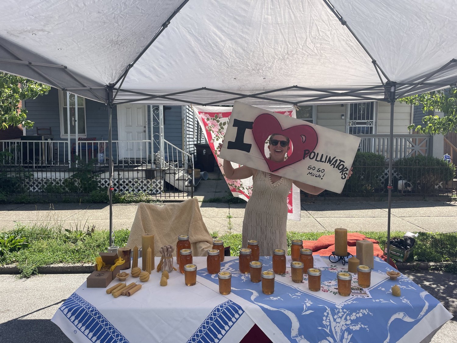 The Beelicious honey table under a market tent